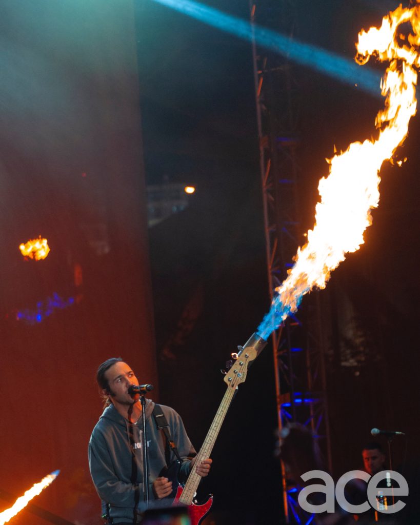 Fall Out Boy bassist Pete Wentz with flaming bass guitar