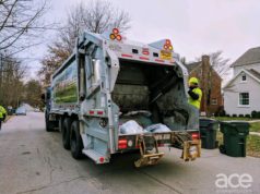 garbage truck with a trash collector on the side: Presidents' Day