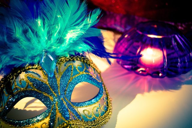 mardi gras mask with blue, yellow, purple colors